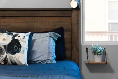 Cozy up in the primary bedroom with a plush king bed, soft linens, and a peaceful space designed for a great night’s sleep.