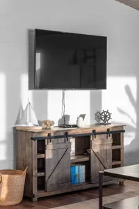 Unwind with your favorite show on the large flat-screen TV in the main living area, with cozy coastal decor and plenty of space to lounge.