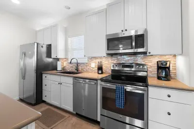 Modern kitchen with stainless steal appliances and all the other utensils needed during your stay to make any meal needed.