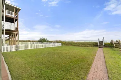Backyard for the family and four legged friends to play and relax after a wonderful day on the beach.