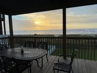 Covered deck with ocean views, perfect for outdoor dining!