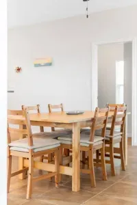 Dining room table with chairs for 6 plus 3 more stools for seating at the island give ample room for everyone to sit down for your meals.