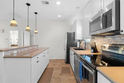 Modern kitchen with stainless steal appliances and all the other utensils needed during your stay to make any meal needed.