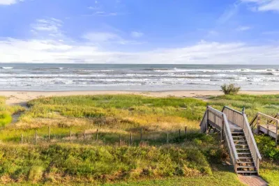 Private walkway over the sand dunes to the beach.