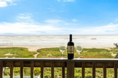 Enjoy breathtaking sunrises and the soothing sound of ocean waves from the front porch deck. 