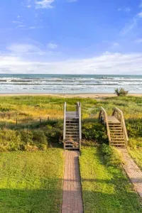 Private walkway over the sand dunes to the beach.