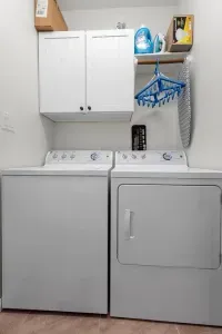 Laundry room with a starter pack of supplies for washing your clothes to rinse out the salt and sand from swimming in the gulf.