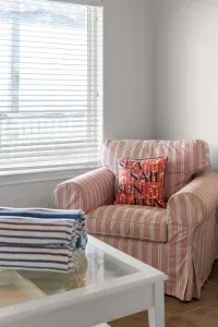 Living room chair located close to the large front window allowing you to take in the wonderful views of the ocean.