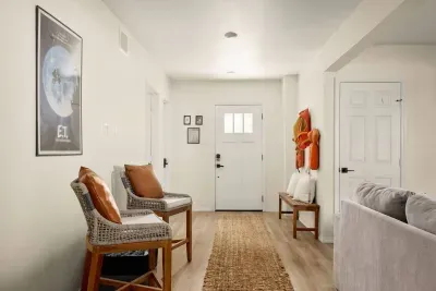 Cozy up by the action! These stylish high chairs offer the perfect spot to watch the game, chat, or simply enjoy the fun vibes of the living room arcade.