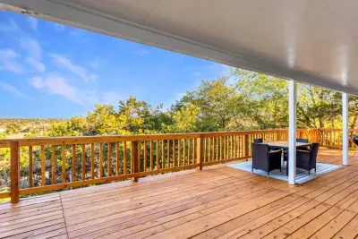 Relax and unwind on the expansive covered deck, complete with comfortable outdoor seating and stunning treetop views. Whether you're sipping your morning coffee or enjoying dinner, this spacious deck offers privacy and scenery for a peaceful getaway.