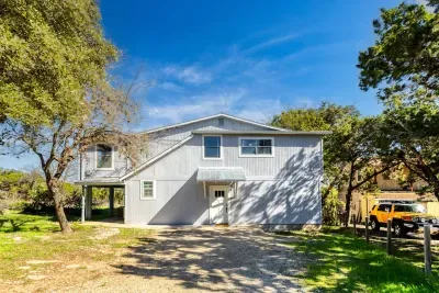 Charming two-story retreat at Canyon Lake with plenty of space, surrounded by trees and nature. Enjoy easy access, private parking, and a peaceful setting perfect for your Texas Hill Country getaway.