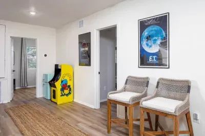 Cozy up by the action! These stylish high chairs offer the perfect spot to watch the game, chat, or simply enjoy the fun vibes of the living room arcade.