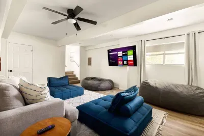 Kick back in the ultimate living room, featuring plush lounge seating, retro arcade game, and fun movie posters. With space for the whole crew, this cozy hangout spot is perfect for family game nights, entertainment, or relaxing after a day of fun.