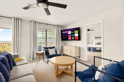 Bright and inviting, this Canyon Lake living room features scenic views, cozy seating, and coastal-inspired décor, perfect for relaxing after a day on the lake or gathering for movies, games, and memorable moments with family and friends.