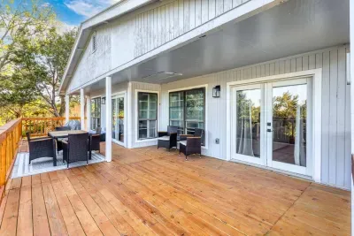Relax and unwind on the expansive covered deck, complete with comfortable outdoor seating and stunning treetop views. Whether you're sipping your morning coffee or enjoying dinner, this spacious deck offers privacy and scenery for a peaceful getaway.