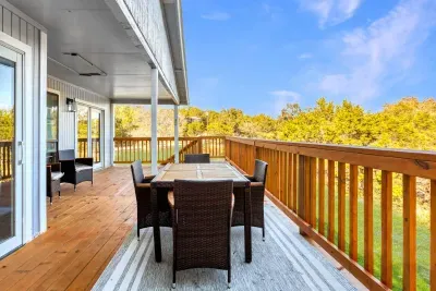 Relax and unwind on the expansive covered deck, complete with comfortable outdoor seating and stunning treetop views. Whether you're sipping your morning coffee or enjoying dinner, this spacious deck offers privacy and scenery for a peaceful getaway.