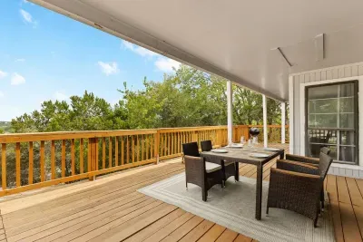 Relax and unwind on the expansive covered deck, complete with comfortable outdoor seating and stunning treetop views. Whether you're sipping your morning coffee or enjoying dinner, this spacious deck offers privacy and scenery for a peaceful getaway.