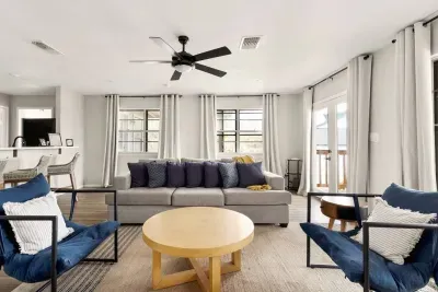 Bright and inviting, this Canyon Lake living room features scenic views, cozy seating, and coastal-inspired décor, perfect for relaxing after a day on the lake or gathering for movies, games, and memorable moments with family and friends.