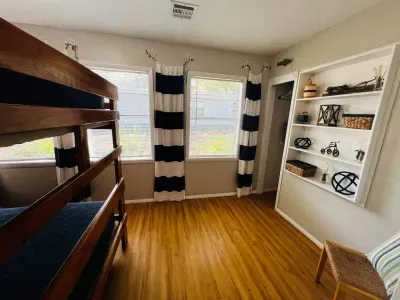 Bedroom 3 has a bunk bed that contains two full sized beds.  Extra linens and fan are in the closet.