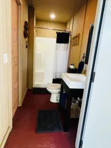 Full bathroom with a standup shower.  Shampoo, conditioner, and body soap are included.  There are plenty of towels and washcloths, as well.