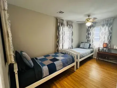 Contains two twin beds and has a ceiling fan.   Extra linens and fan are in the closet.