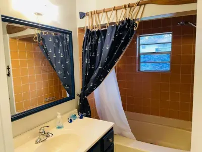 Full bathroom with tub and shower.  Shampoo, conditioner, and body soap are included.  There are plenty of towels and washcloths, as well.