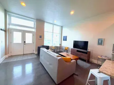 Kick back and relax with comfy seating, a smart TV for all your streaming needs, and natural light pouring in through the large window.