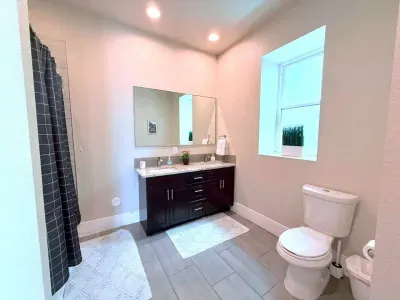 Fresh, clean, and functional, this full bathroom features a spacious bathtub, perfect for a relaxing soak after a long day, plus all the essentials to keep you feeling at home.