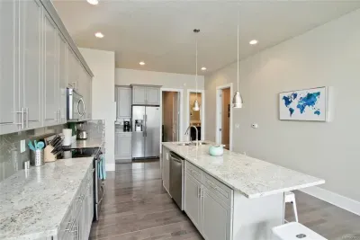 Conveniently located near both bedrooms, this kitchen makes late-night snacks or early morning coffee runs quick and easy, no long walks required!