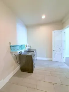 Enjoy the convenience of a spacious laundry area with a full-sized washer and dryer, perfect for keeping things fresh during your stay.