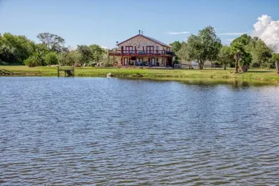 Our beautiful home boasts stunning stone-cladding, a multi-level oversized deck, and direct frontage on a stocked pond. Enjoy the spacious 5-acre property from the deck or waterfront.