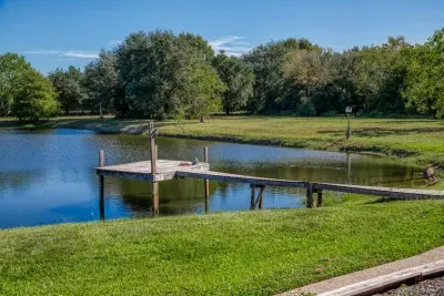 Cast a line from your private fishing pier extending over the tranquil, stocked pond! This peaceful spot is perfect for enjoying the scenery, watching wildlife, or teaching the kids to fish. Enjoy the best of the 5-acre property.