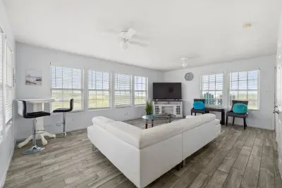 Spacious living room with amazing ocean views and Roku TV for your streaming.  