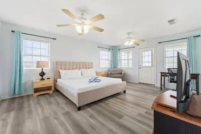 Master bedroom includes a king sized bed.  Roku TV for your streaming pleasure.  On suite bathroom that includes bathtub/shower and double sink.  Access to 3rd level deck to watch those amazing sunrises.  Twin sleeper sofa if needed.