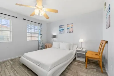 Queen sized bed with two twin size bunkbeds.   Great place for a small family to rest up after a wonderful day on the beach. Located on the main floor with the kitchen, half bath, and living room.