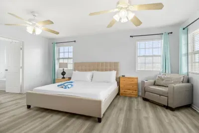 Master bedroom includes a king sized bed.  Roku TV for your streaming pleasure.  On suite bathroom that includes bathtub/shower and double sink.  Access to 3rd level deck to watch those amazing sunrises.  Twin sleeper sofa if needed.