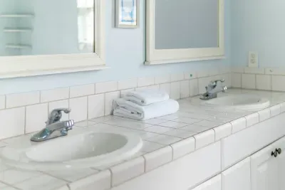 Bright full bathroom with a double vanity.
