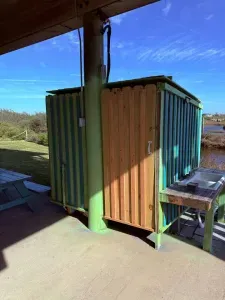 Patio includes a 2nd outdoor shower that includes hot and cold water.