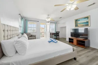 Master bedroom includes a king sized bed.  Roku TV for your streaming pleasure.  On suite bathroom that includes bathtub/shower and double sink.  Access to 3rd level deck to watch those amazing sunrises.  Twin sleeper sofa if needed.