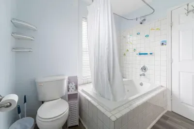 Full bathroom with a tiled soaking tub and shower.
