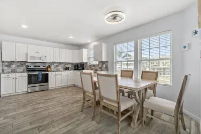 Open concept kitchen with dining room table.