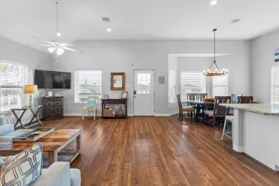 Enjoy seamless flow in this bright, open-concept space! The comfortable living area directly adjoins the inviting dining nook, making it perfect for socializing and keeping everyone together during your stay.