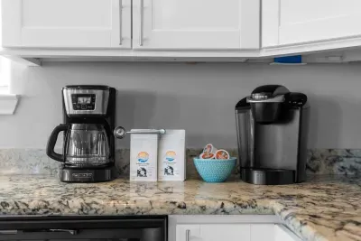 Start your day right! This well-equipped kitchen counter features dual coffee options: a traditional drip Coffee maker and a Keurig , ensuring you have your favorite brew ready to go. Complimentary coffee supplies are provided.