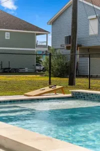 Make a splash! The sunny, fenced backyard features a sparkling blue Pool and deck, perfect for lounging. 