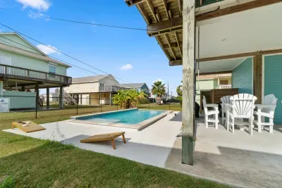 Enjoy the ultimate outdoor space! The sunny backyard features a sparkling Pool , yard games, and a covered patio with Outdoor furniture. It’s the perfect place for fun and relaxation in the coastal air.