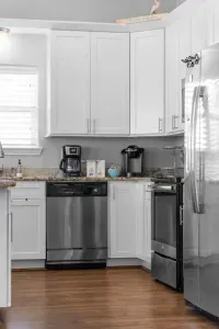 Enjoy modern convenience! This bright kitchen includes a stainless steel dishwasher and a well-stocked coffee bar with both drip and single-serve options, ensuring easy clean-up and a perfect start to your day.