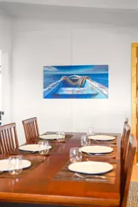 Gather around the cozy dining table for meals, games, or good conversation, seating for six right next to the heart of the home. ️