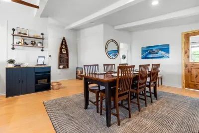 Gather around the cozy dining table for meals, games, or good conversation, seating for six right next to the heart of the home. ️