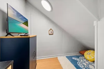Tucked under the stairs, this charming secret room offers a snug retreat, just steps away from the laundry area, a perfect little nook for kids or quiet moments.