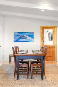 Gather around the cozy dining table for meals, games, or good conversation, seating for six right next to the heart of the home. ️